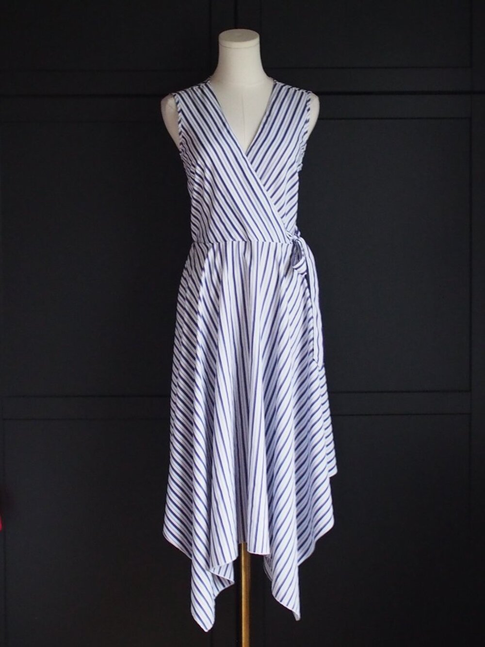 Mlle Gabrielle | Sleeveless Faux Wrap Striped Handkerchief Hem Dress